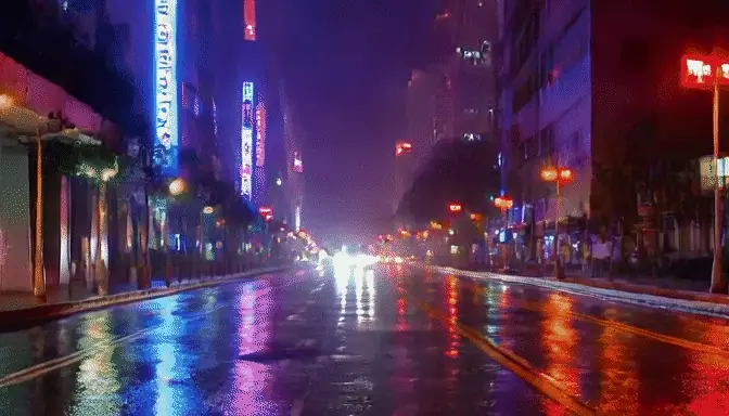 a neon-lit city street at night in the rain, glowing reflections on wet asphalt, slow camera push forward